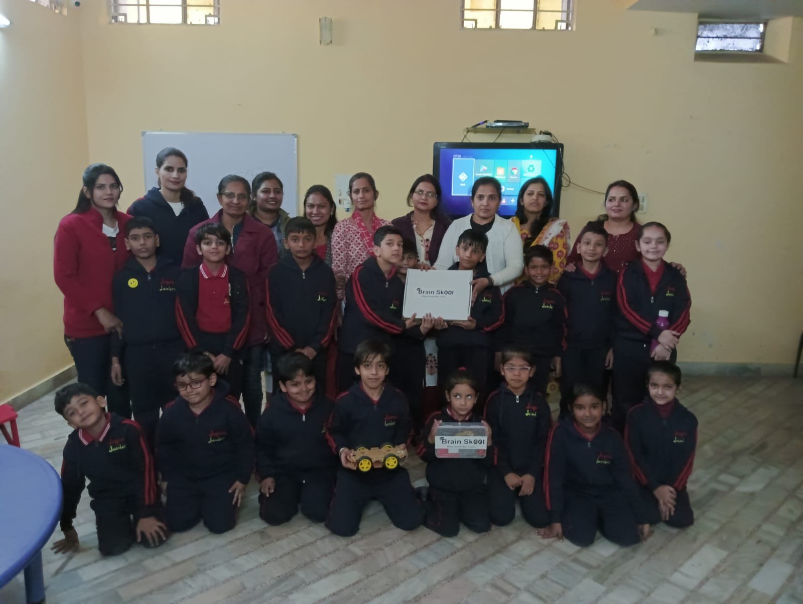 Brain Skool robotics kit with students